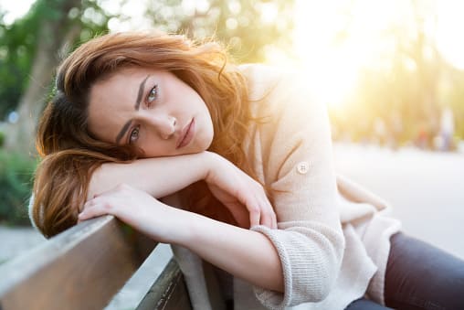 young woman feeling depressed and at loss of energy